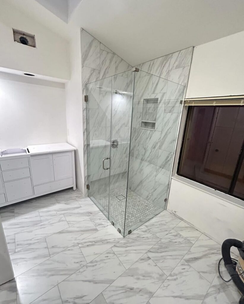 A Shower Room With Marble Wall Tiles Image